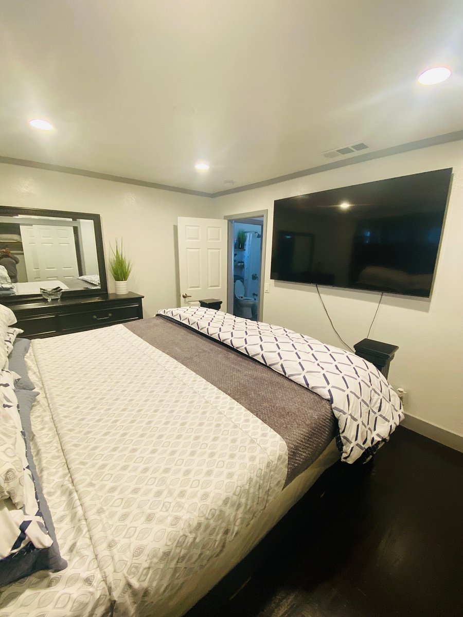 Main bedroom with King bed and 75 smart TV