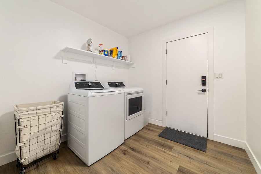 Fully equipped laundry room with brand new appliances and starter essentials