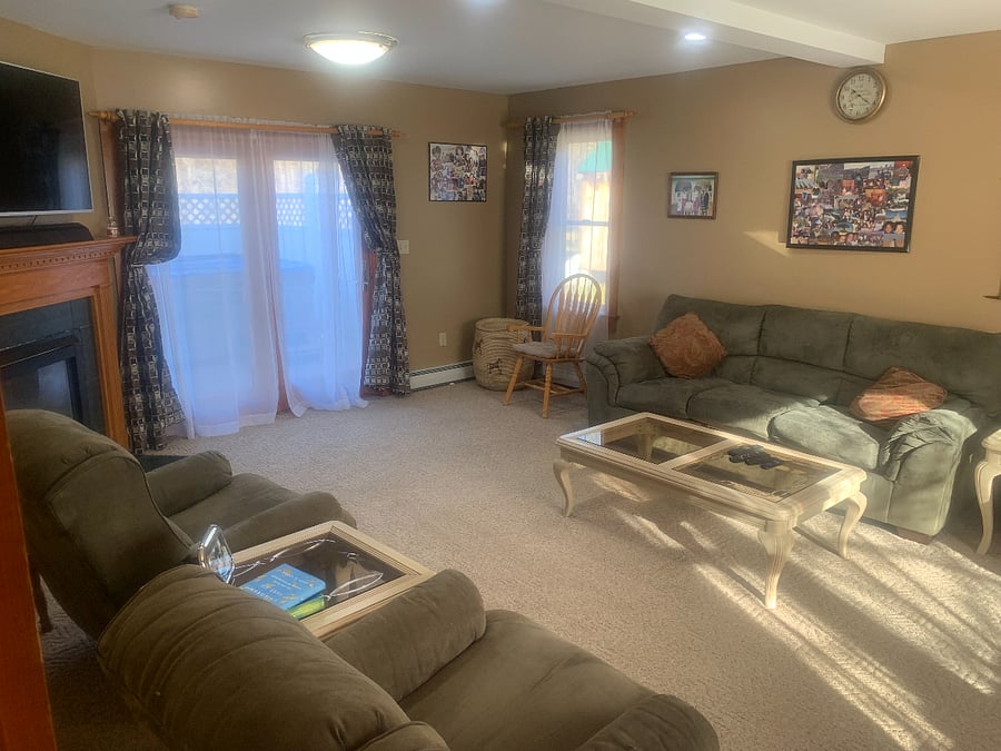 Living room with 3 recliners and a couch.
