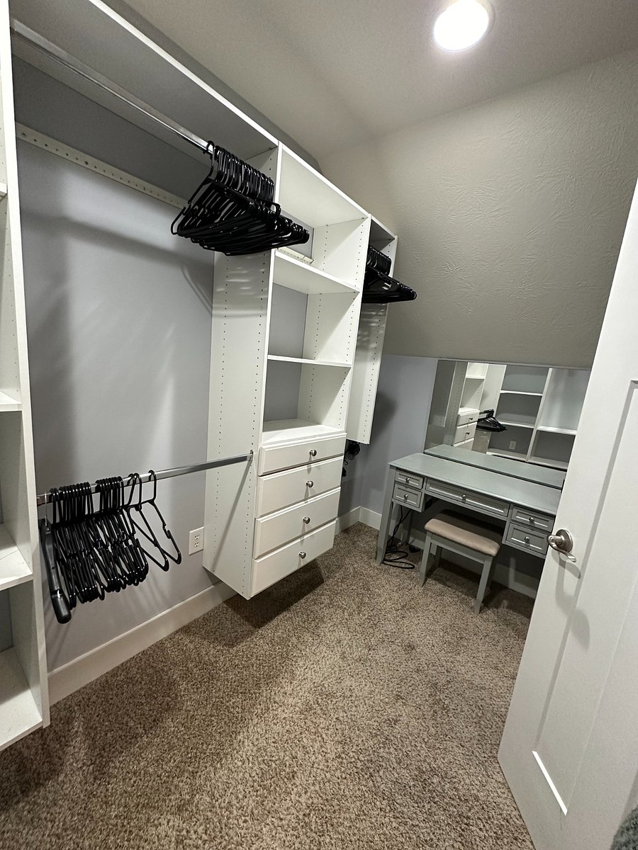 Walk in closet + vanity in master bedroom.