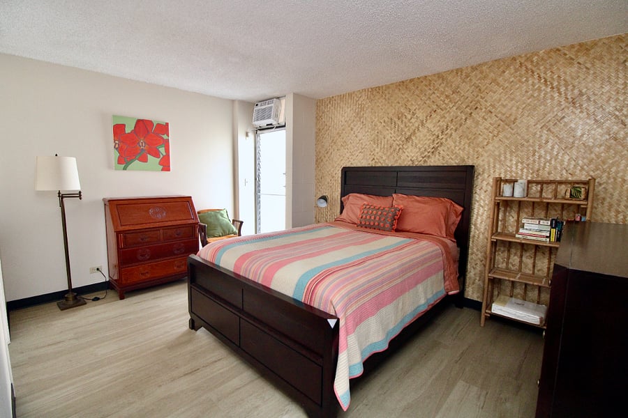 Master bedroom view with airconditioning. Rosewood secretary desk with drawer space and large chest of drawers and closet are out of view.