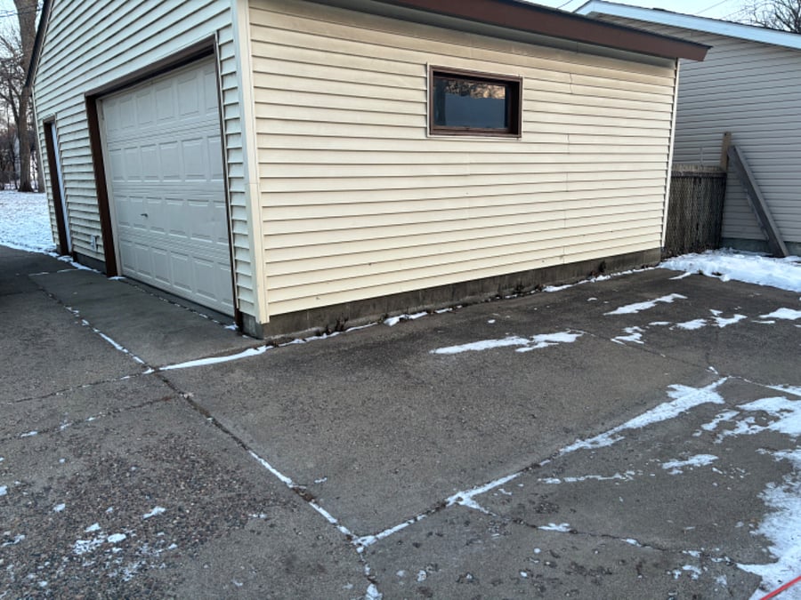 View from alley towards house. There is an additional parking Space on Alley (behind Owners' Garage).