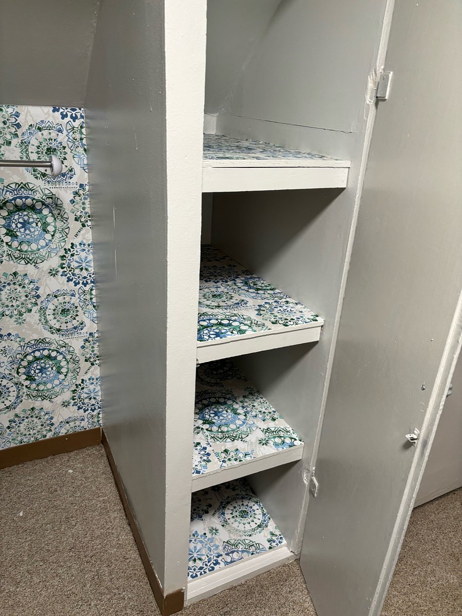 Upstairs: Built-in shelving on right side of closet.