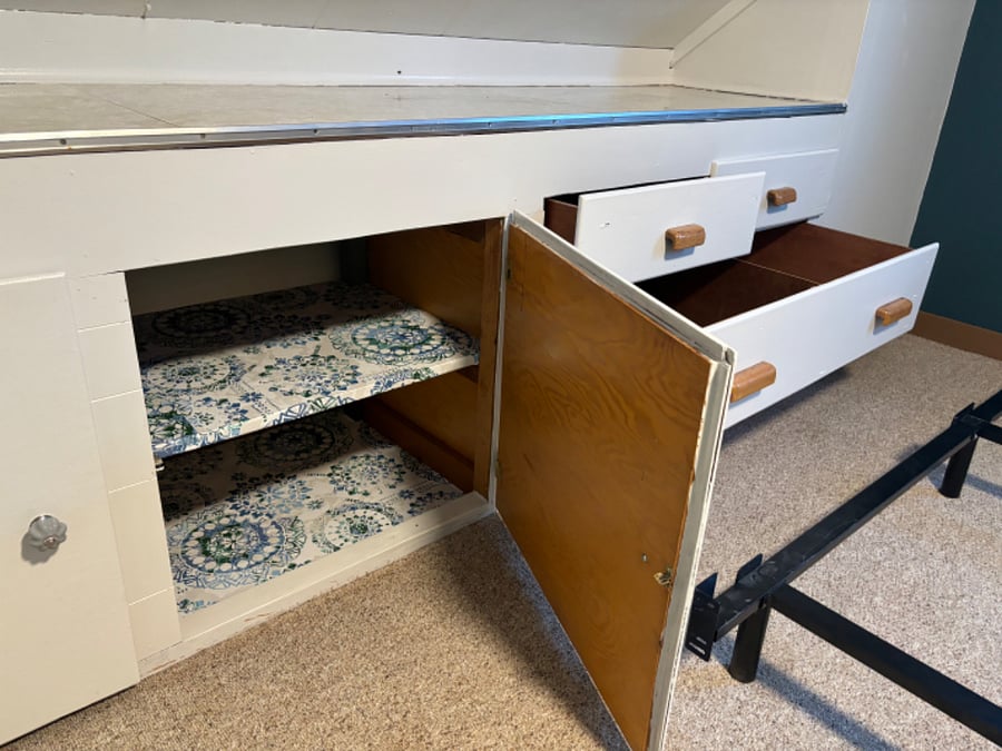 Upstairs: shelving and drawers in Cupboard.