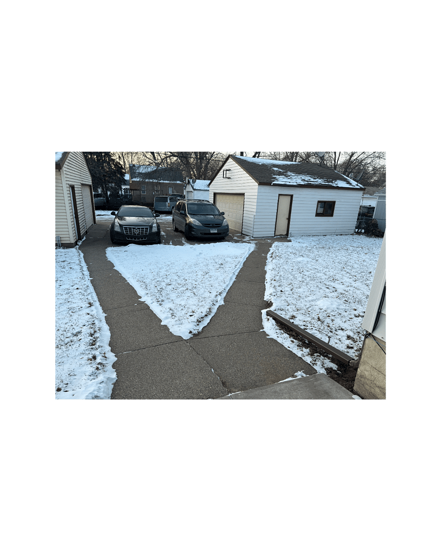 View from Side door entrance towards garages. Garage on left is Owners' Garage. Garage on right side is Renters' Garage. A generous 2 stalls wide and has a garage door opener. The only area of the yard that is NOT fenced is between the 2 garages.