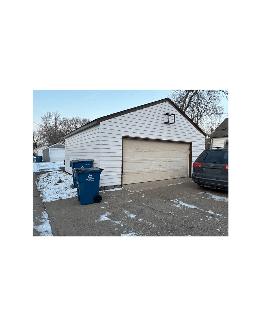 View from alley towards house.
This double garage with opener included with rental!