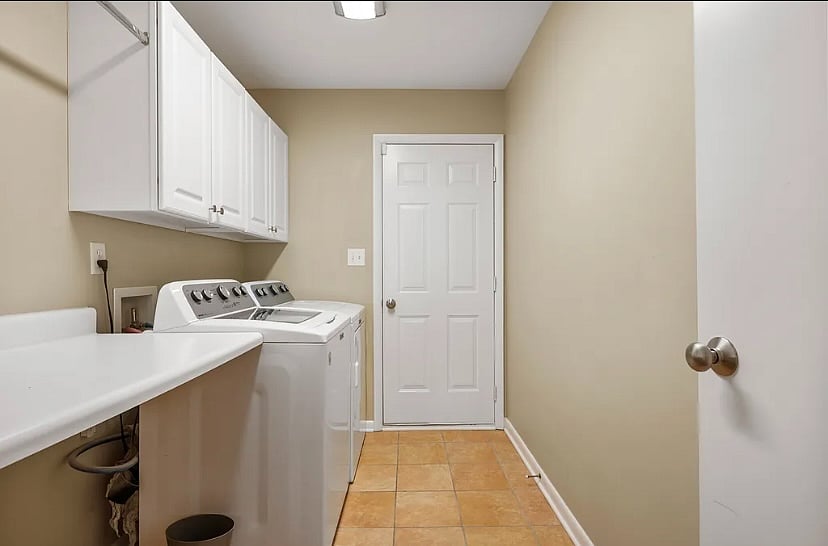 Washer and Dryer in laundry room that leads to garage