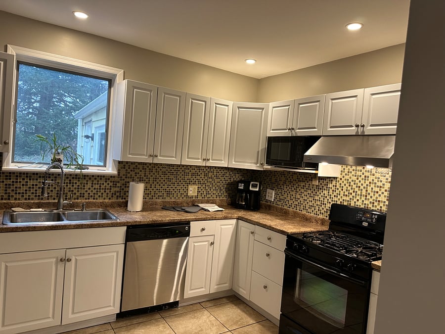 Kitchen, plenty of counter space, microwave, dishes, dishwasher, coffee maker 