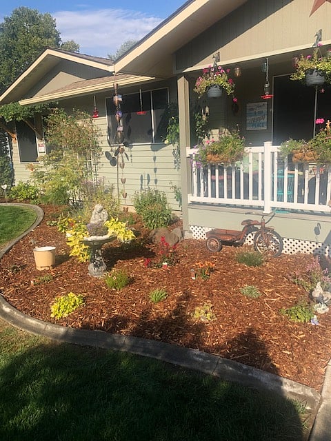 Lovely landscaping surrounds the unit.