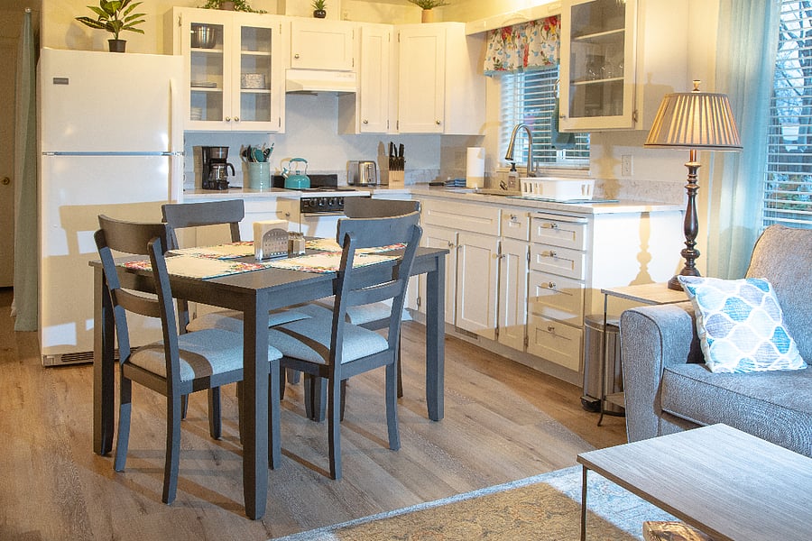 Full kitchen with 4-person table. Full size-refrigerator and and apartment size oven/stove has 4 burners. All dishes and cooking utensils included.
