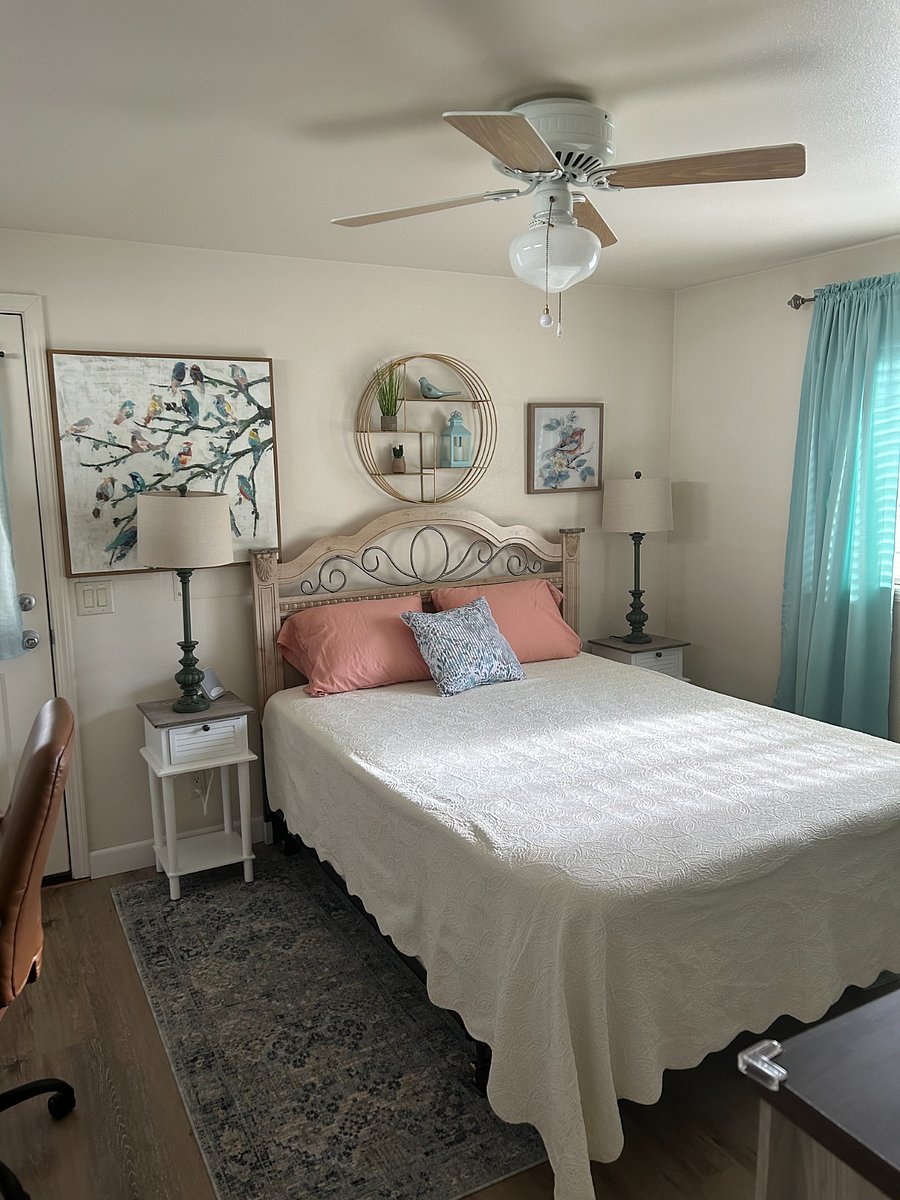 Bedroom features a queen-size bed with extra sets of sheets. Curtains on the main window are room darkening.