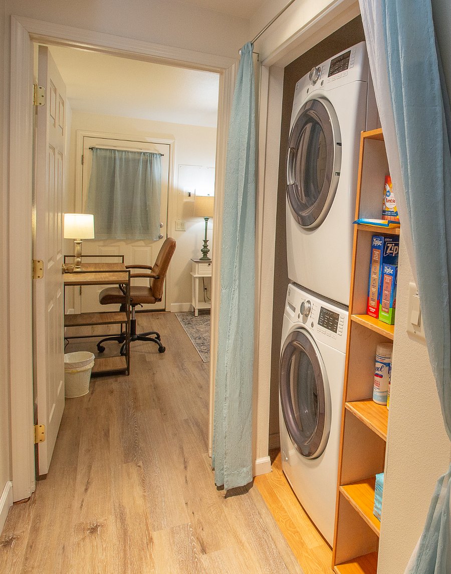 Laundry center is located in the hallway to the bedroom and features full-size washer and dryer. Cleaning supplies have been provided.