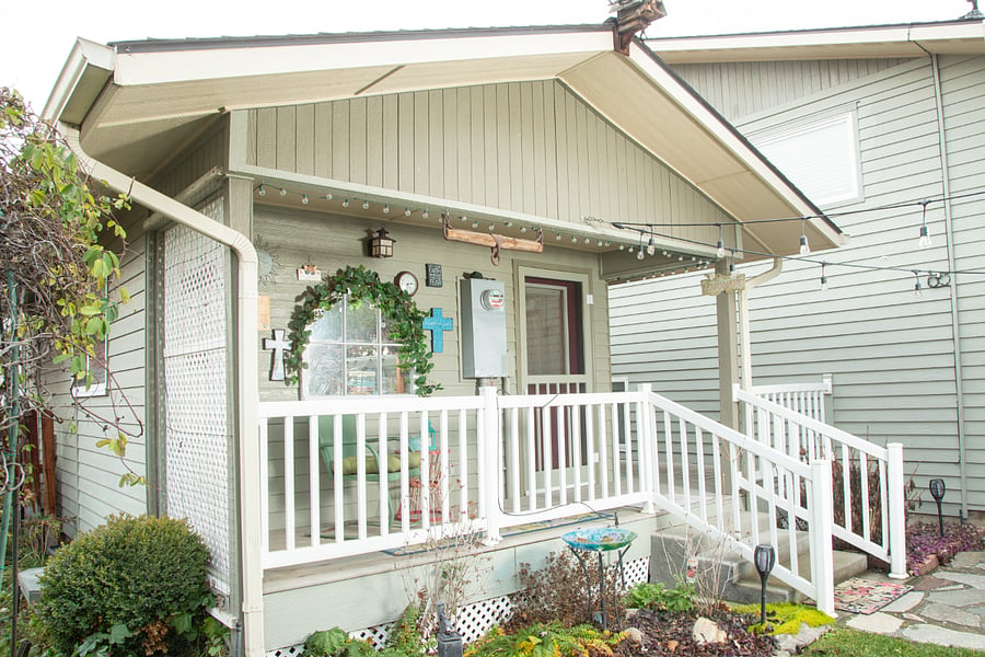 The unit features a covered back porch overlooking the beautifully kept backyard.