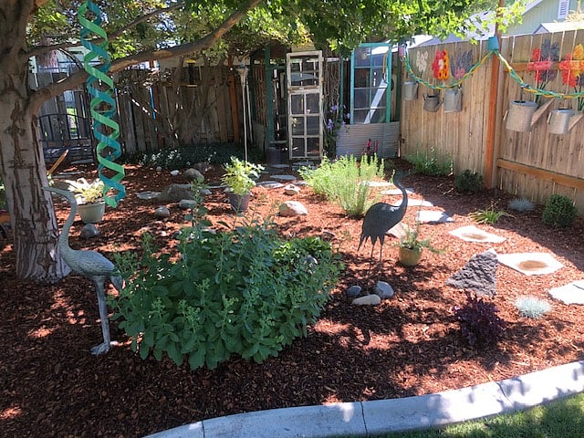 Shared backyard includes a "Secret Garden" corner.