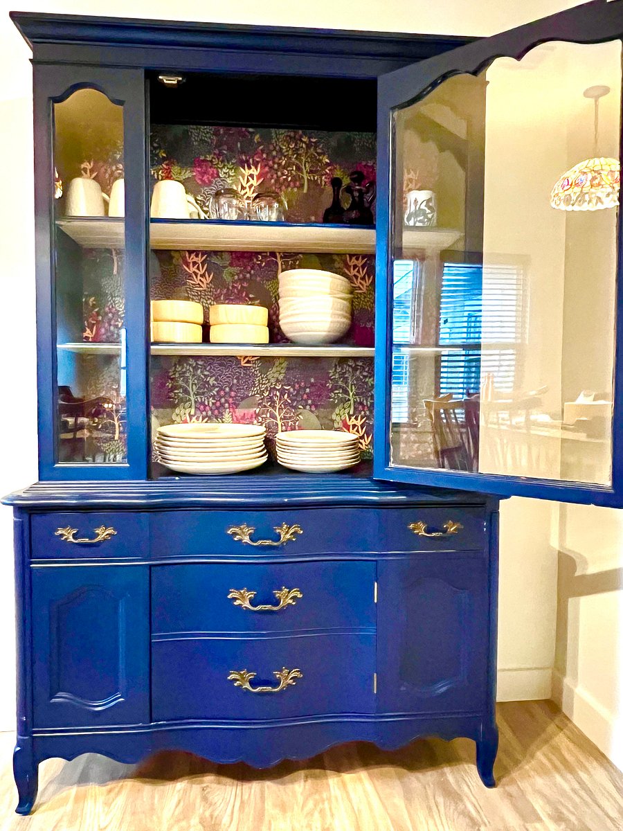 Hutch with dishes in dining room