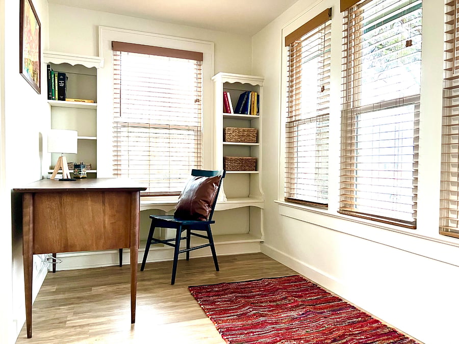 Sunroom at front of the house. Desk and shelving