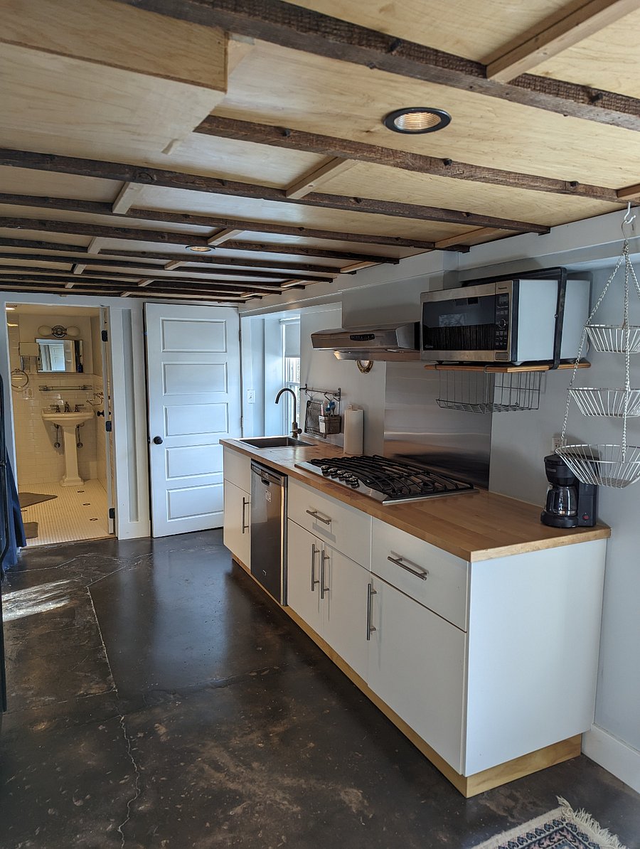 Kitchen area. 5 burner gas stove, dishwasher, microwave, coffee maker. No oven.