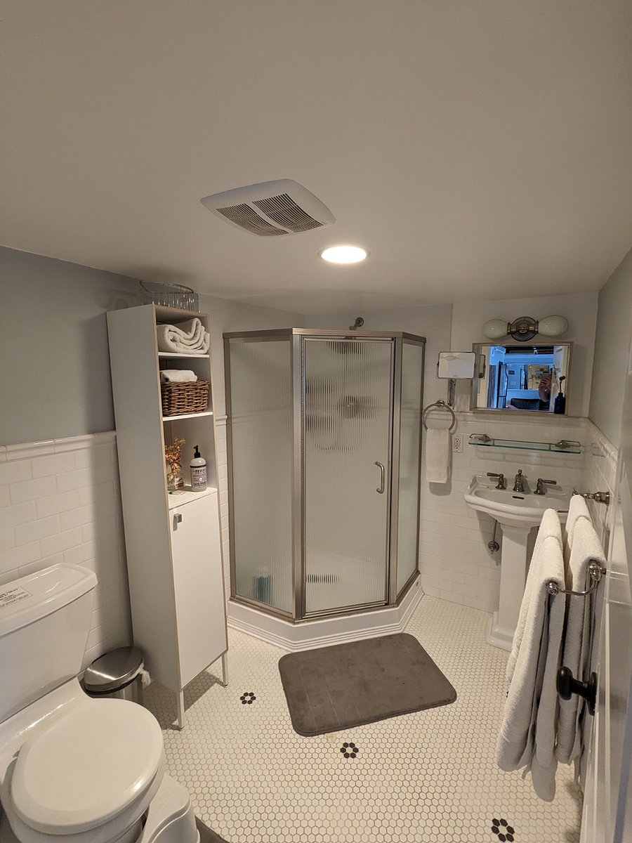 Walk-in shower with hand held.