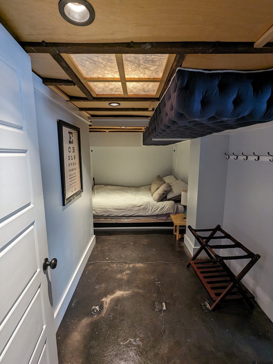 Sleeping 'nook' with privacy shades.