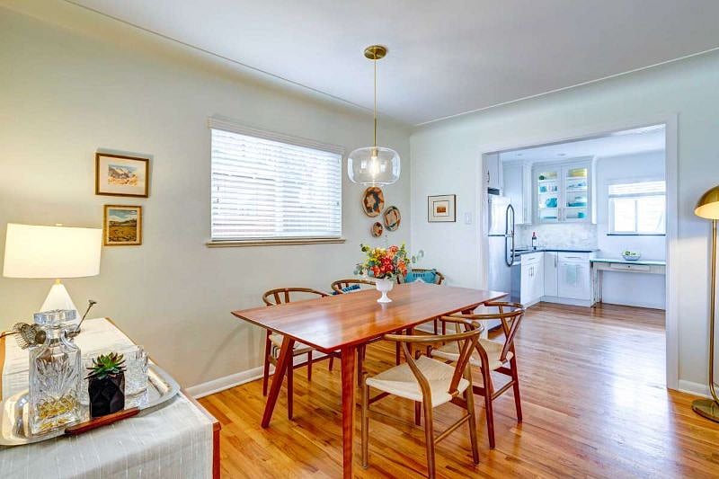 Main floor dining area with six-person dining table.