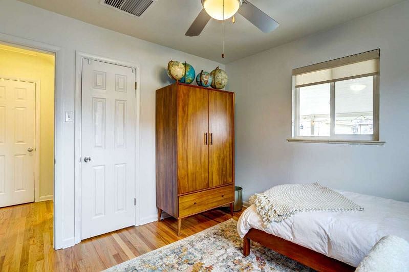 Bedroom on main floor with twin-sized bed and desk