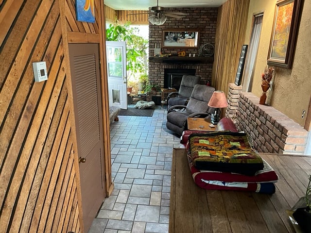 Looking down at the den and the back yard door