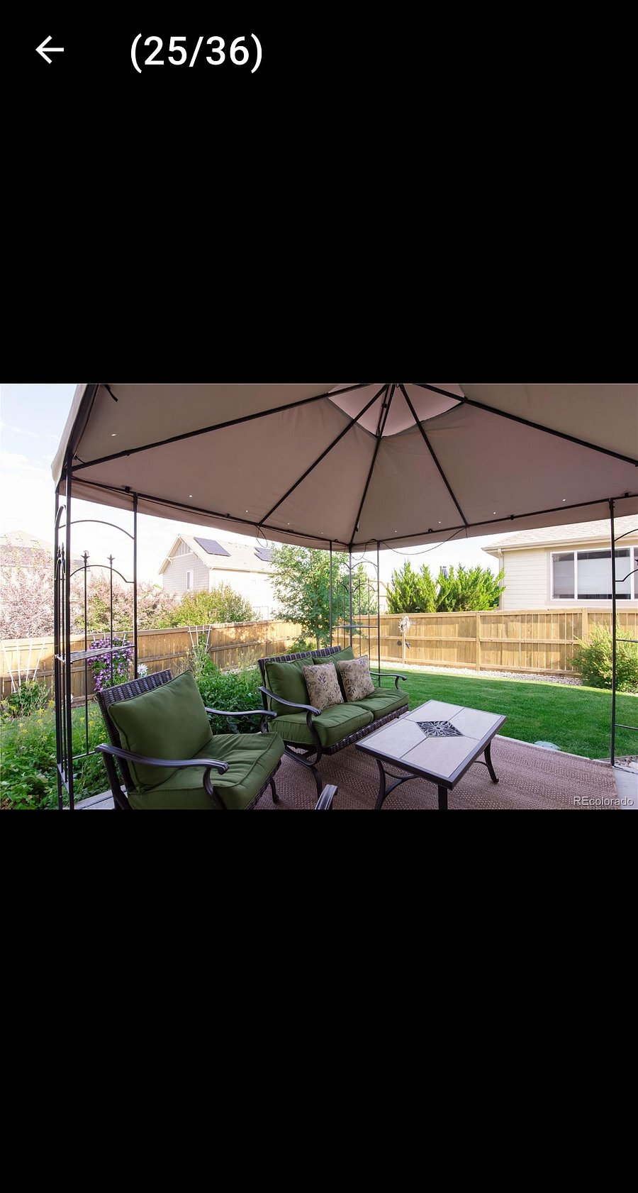 Backyard patio, fenced yard, furniture has changed