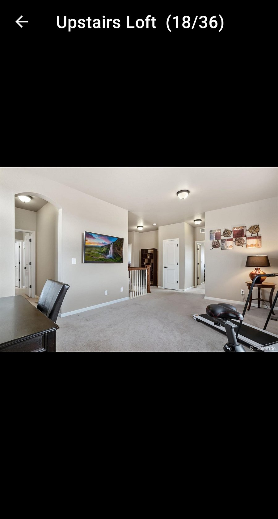 Spacious upstairs living space/office. Furniture has changed