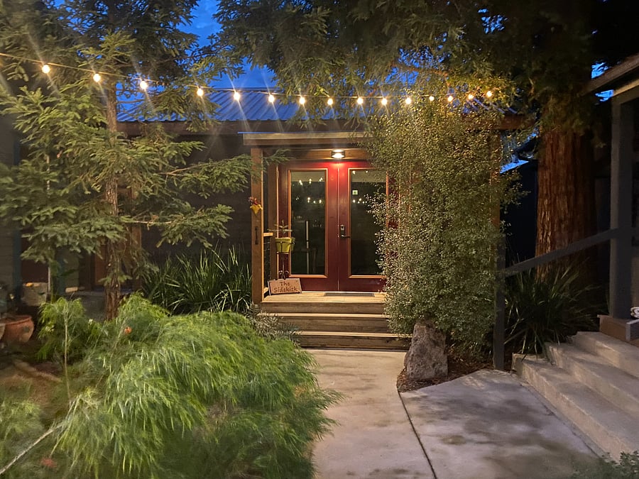 Entrance to The Sidekick at night