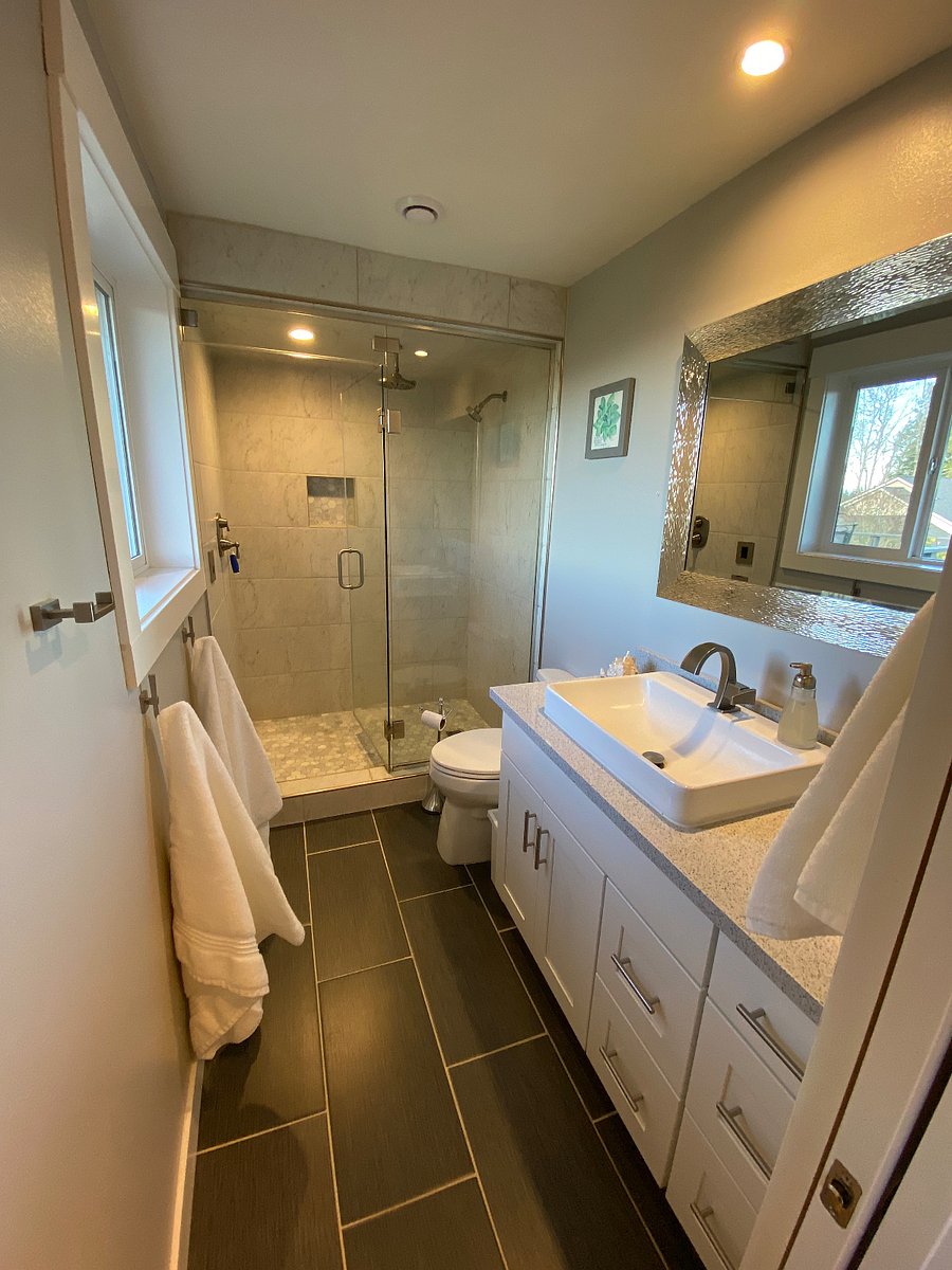 Private ensuite bathroom with updated fixtures and modern design. Beautiful walk-in tile shower with strong water pressure.