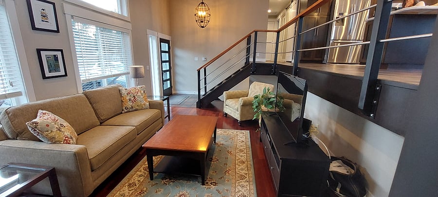 Bright, comfortable shared living room for relaxing after long shifts.