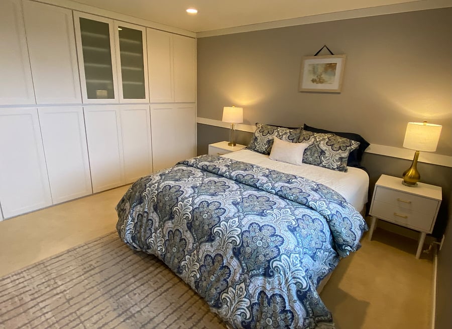 Comfortable queen bed with high-quality linens and peaceful atmosphere.