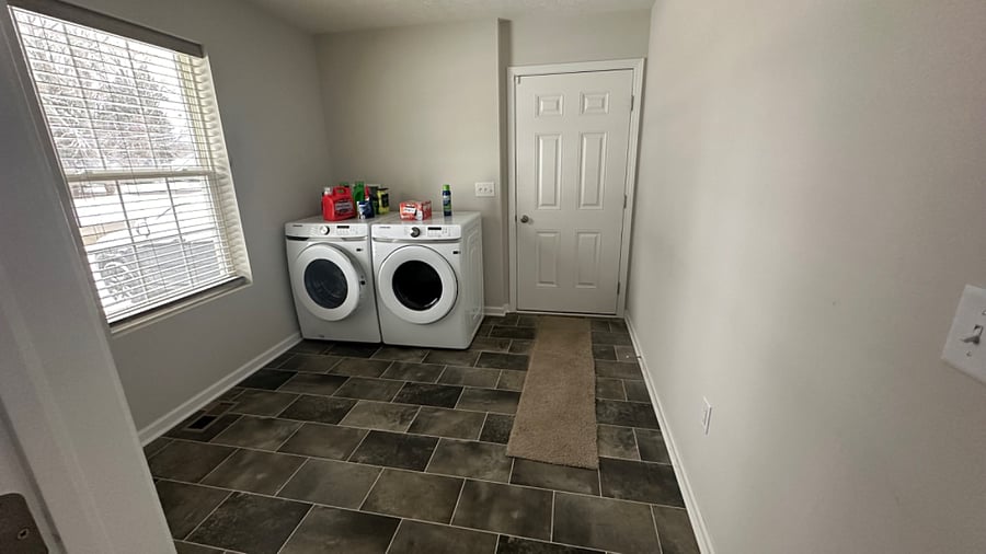 Laundry Room on main floor (no stairs to climb) at attached garage entrance.