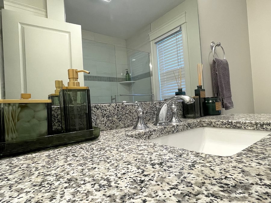 Beautiful granite vanity with every day necessities.