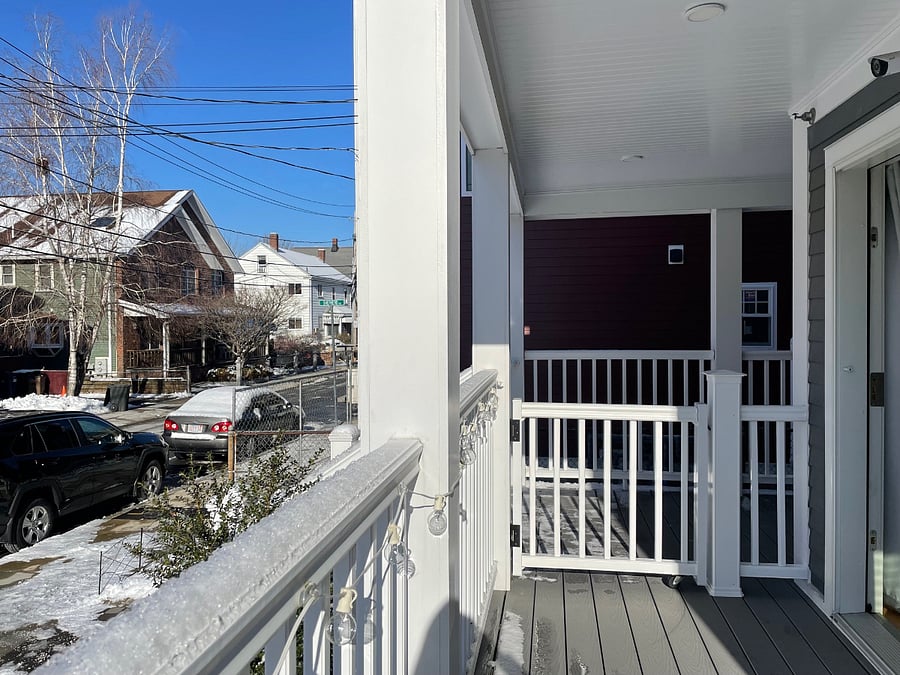 Private front porch overlooking a relatively quiet, one way street