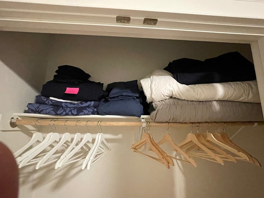 Quality linens, white sheet sets with navy and emerald green duvets filled with Macys' down comforters. Ahhh- hotel comfort for the weary worker/traveler.