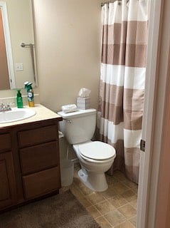 View of Toilet, sink and tub/shower from door