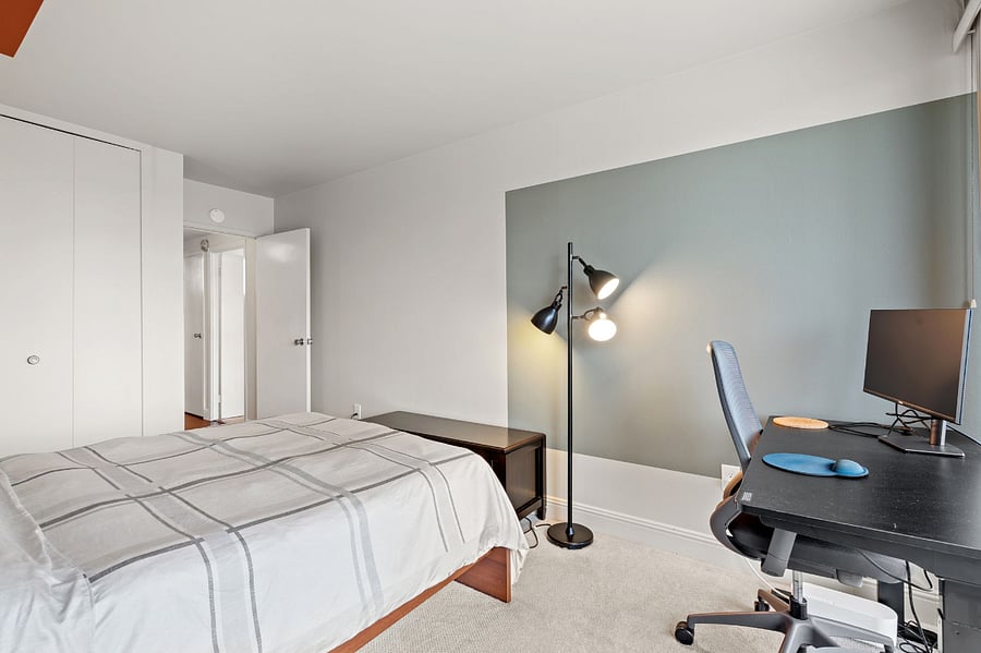 2nd Bedroom with a desk and an attached balcony.