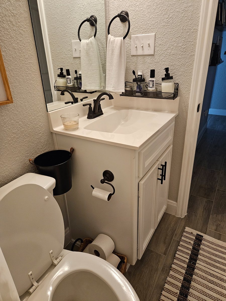 Another angle of the bathroom. The bottom of the sink will give you plenty of space to store your stuff.