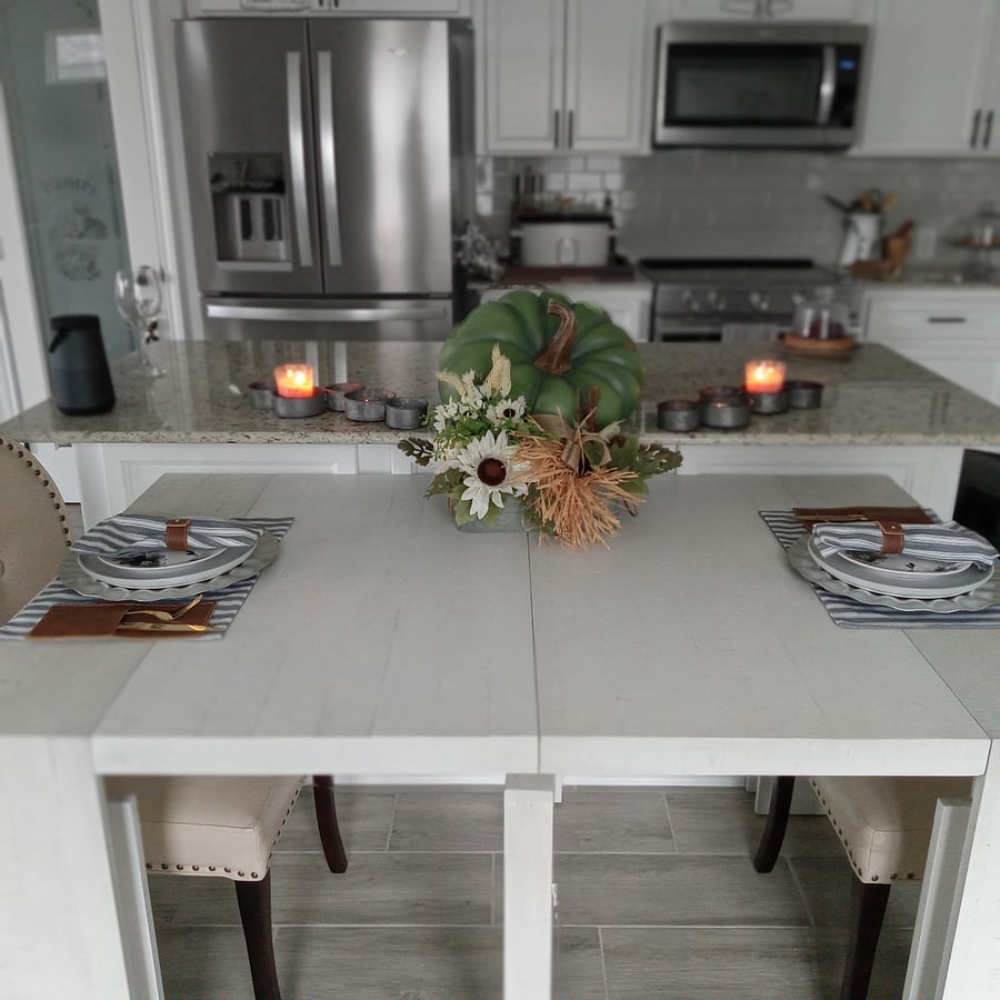 Dining Table is along the kitchen island which transforms to 12 people.