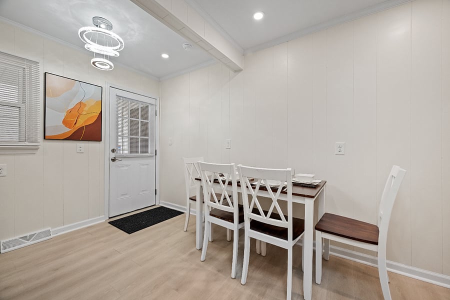 dining table and access to the back door, right by the laundry room.