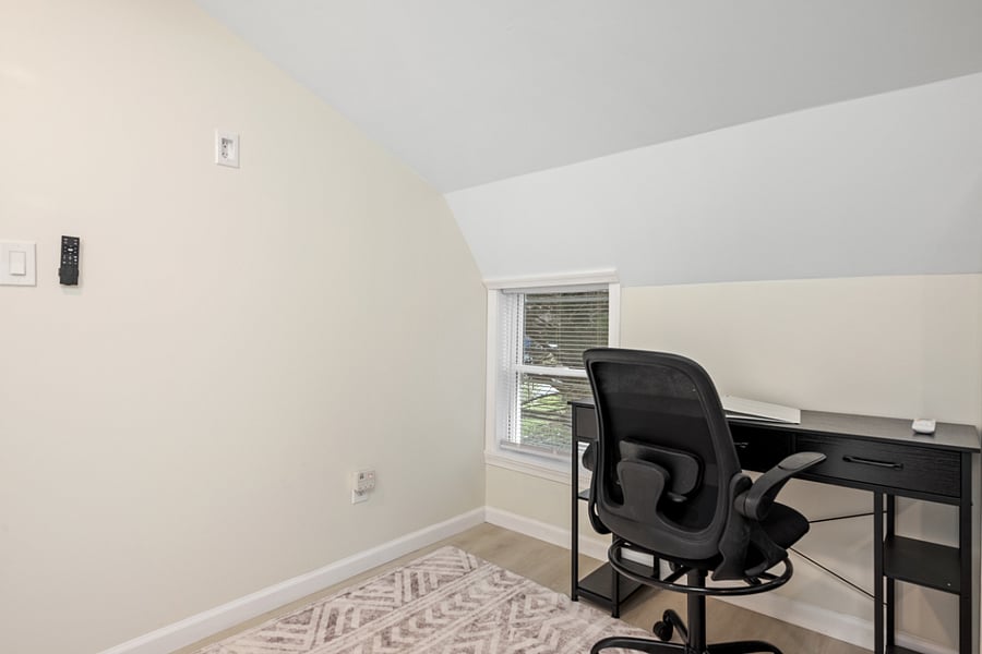 The TV wasn't installed when this photo was taken but it it to the left of the desk.