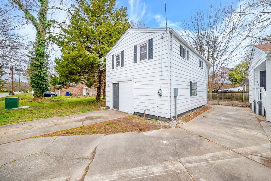 the entire driveway is yours to use. Not shared w the house on the right. They have another driveway, on another street too, since this is a corner lot property