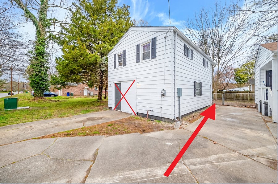 entrance door to your unit is on the right side of the building, towards the back. Not the front door seen in the photo w an X