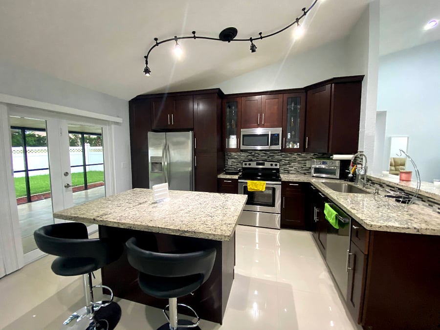 Gorgeous kitchen with 42" slow close Cherry wood cabinets, granite countertops & stainless steel appliances.