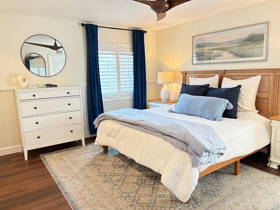 Comfortable King size bed, large dresser and blackout curtains create the perfect sleeping space.