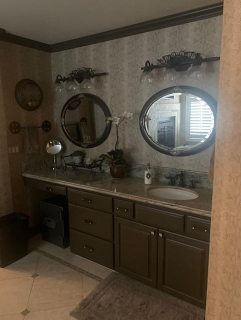 Owners Suite ensuite bathroom. Two closets.  One closet is walk in, but both are built out. Separate toilet room with private door. 2 vanity areas. 