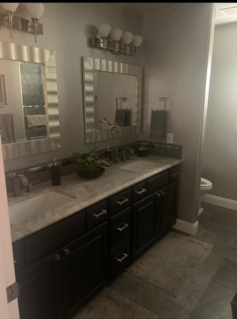 Shared hallway bathroom with double vanity sinks (upstairs)