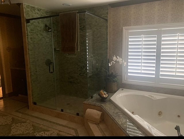 Owners suite bathroom with soaking tub and walk in shower. 