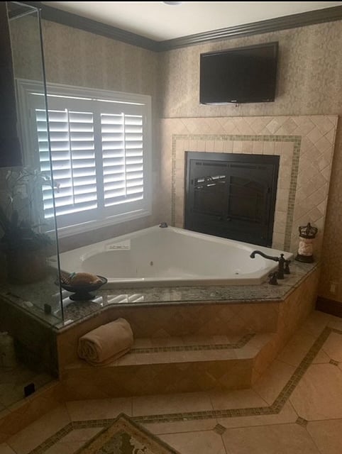 Owners suite has tv and fireplace!